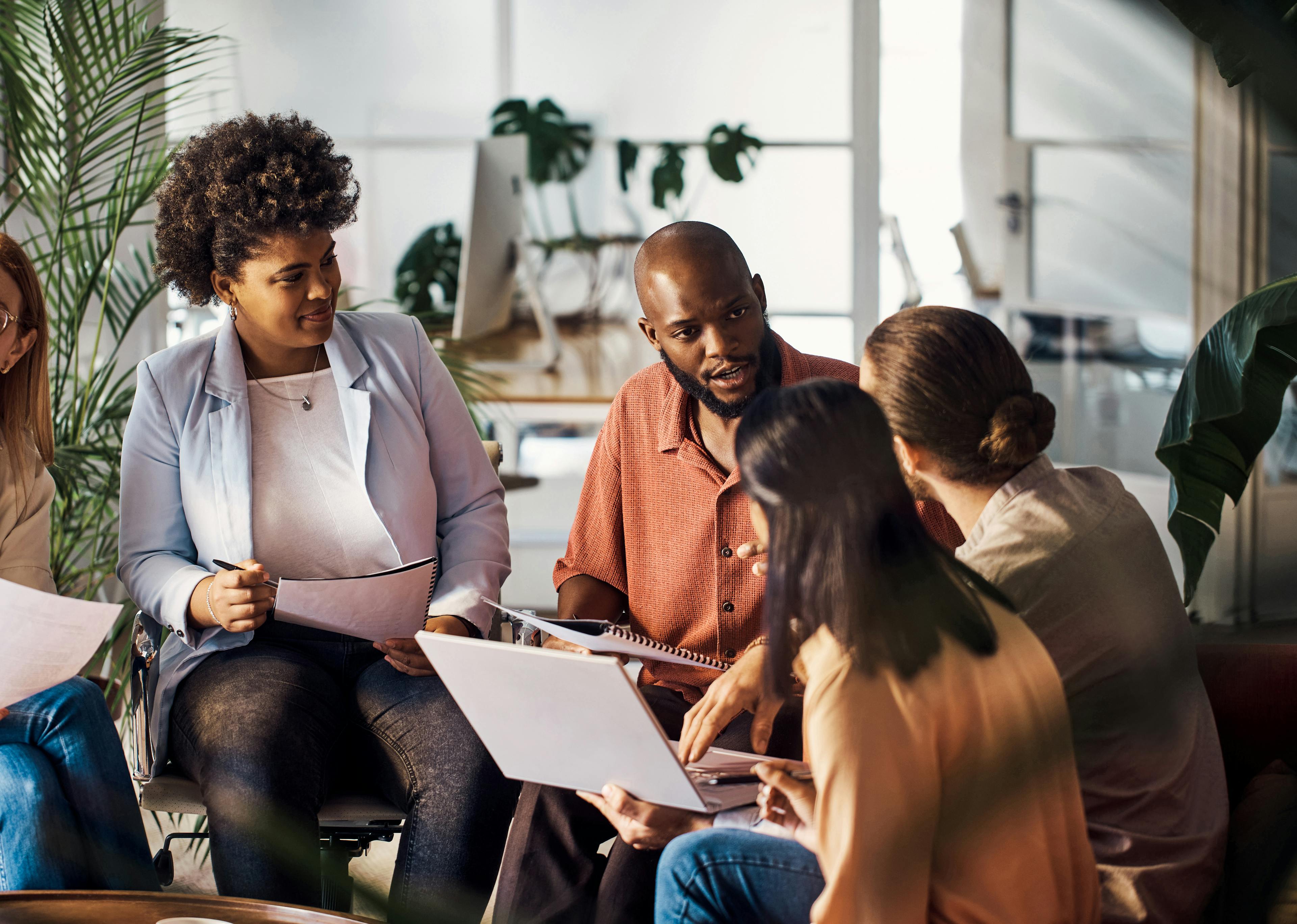 People collaborating in office setting.